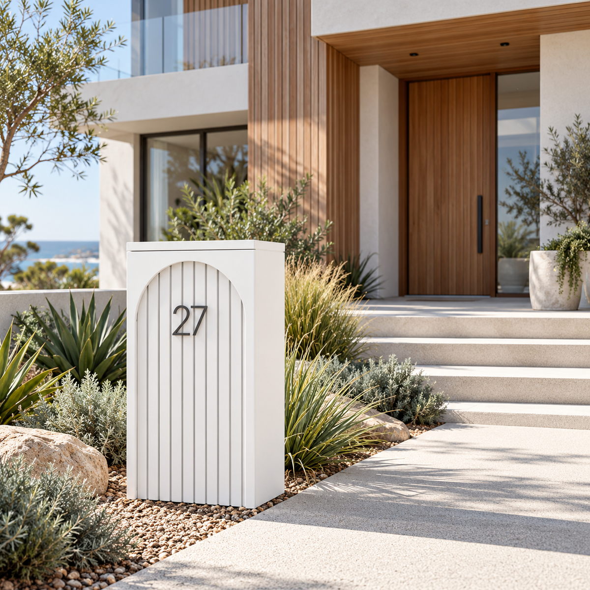 The Yamba white arched parcel letterbox beside a contemporary Australian home entrance